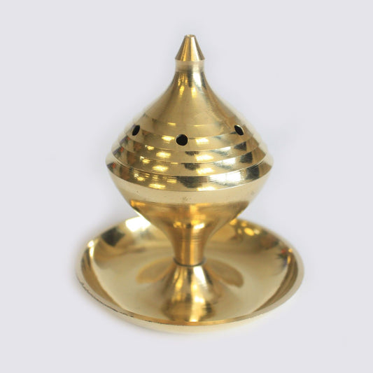 Polished medium brass incense burner with a classic handcrafted design on a neutral background.
