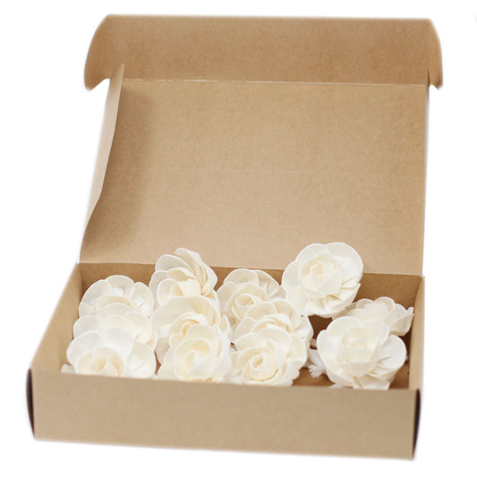Handcrafted small lotus flower made from white sola wood with an attached cotton string for fragrance diffusion.