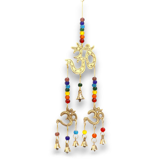 Decorative brass wind chime featuring a central Om symbol, colourful chakra beads, and seven hanging bells.