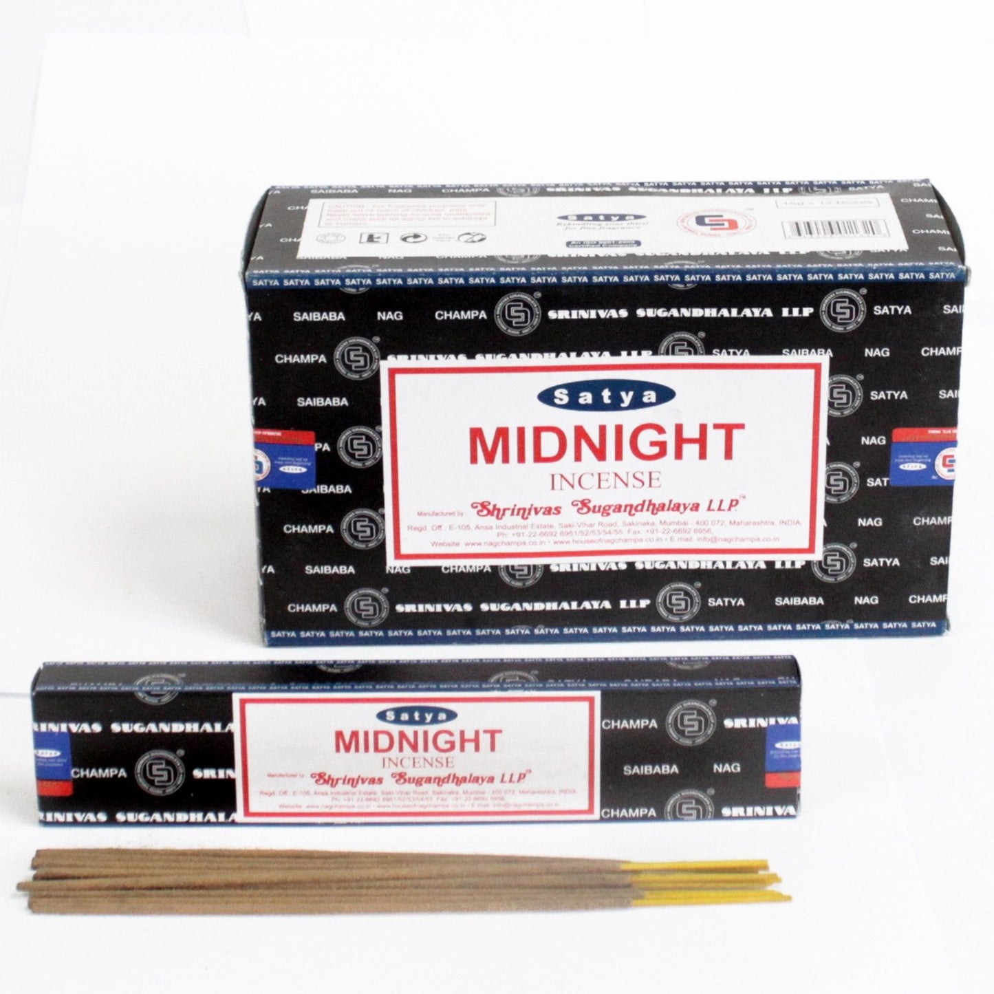 Close up of a 15 gram pack of dark blue and black incense sticks on a wooden surface.