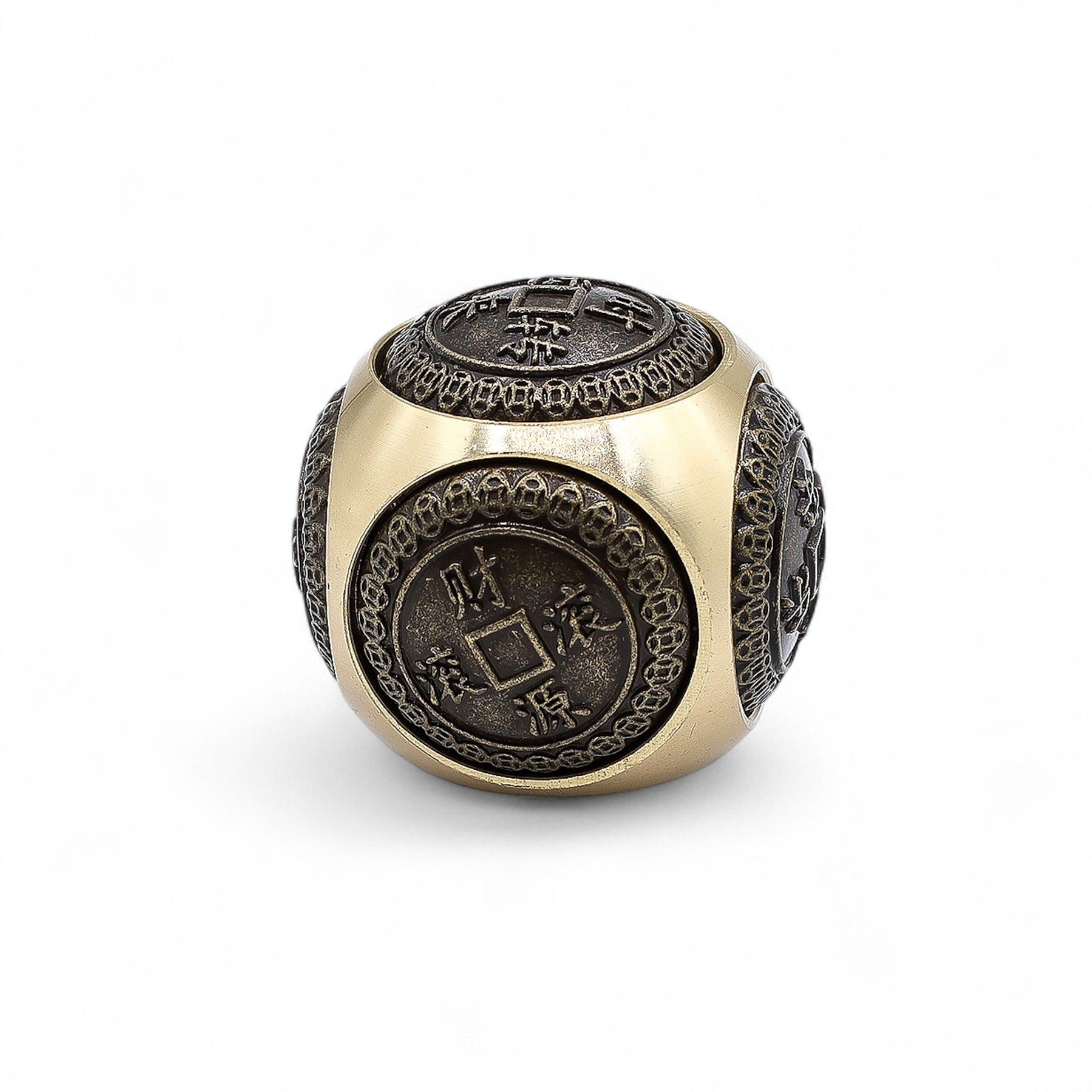 Small rounded decorative dice with intricate traditional Chinese coin motifs symbolising wealth and abundance.