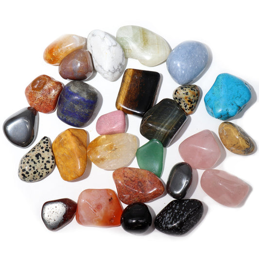 A collection of various colourful polished tumble stones including pink, green, and brown varieties.