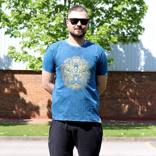 Small blue stone washed t-shirt featuring a white Hamsa hand symbol on the front.
