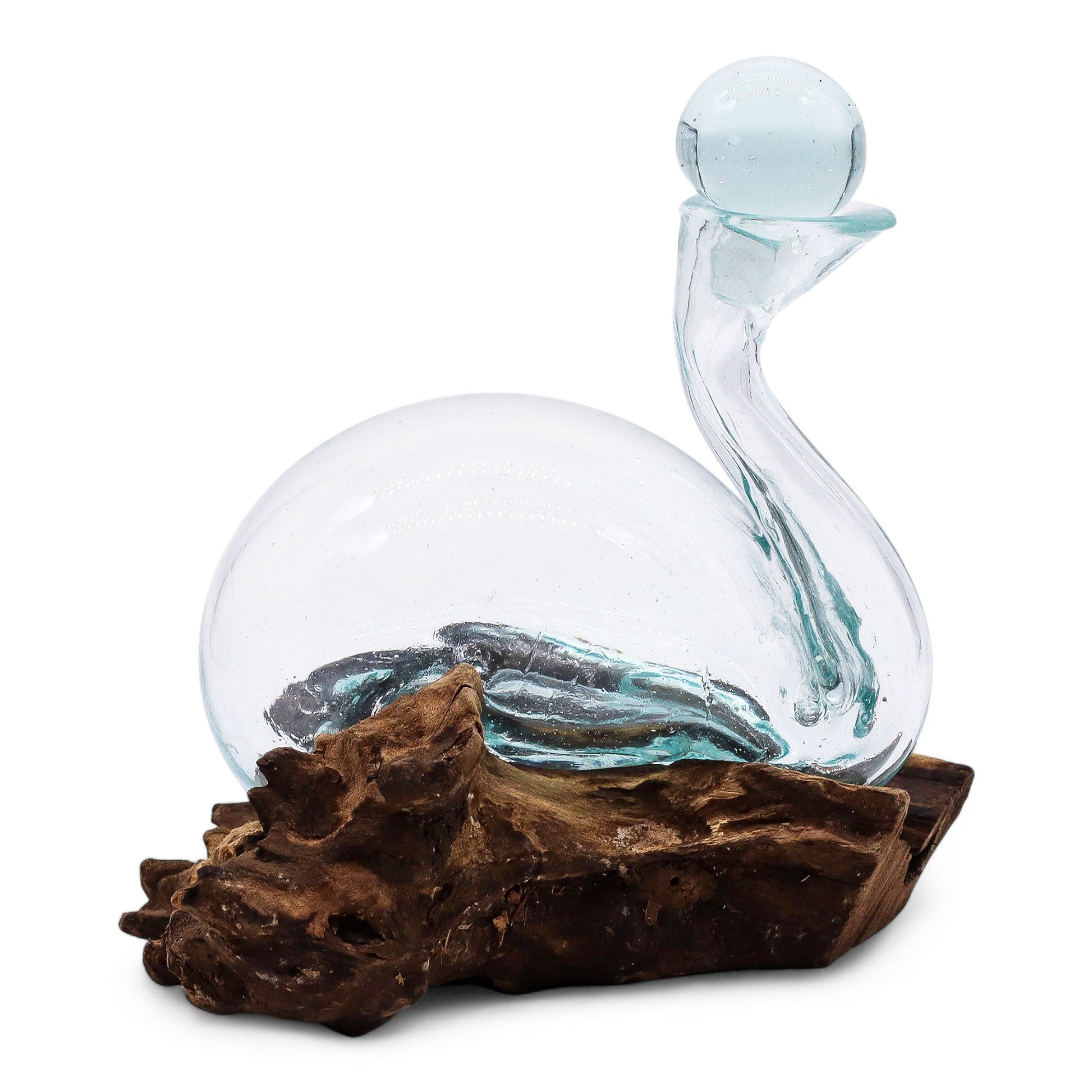 Hand-blown molten glass decanter in the shape of a duck, slumped over a natural reclaimed wood base with a glass stopper.
