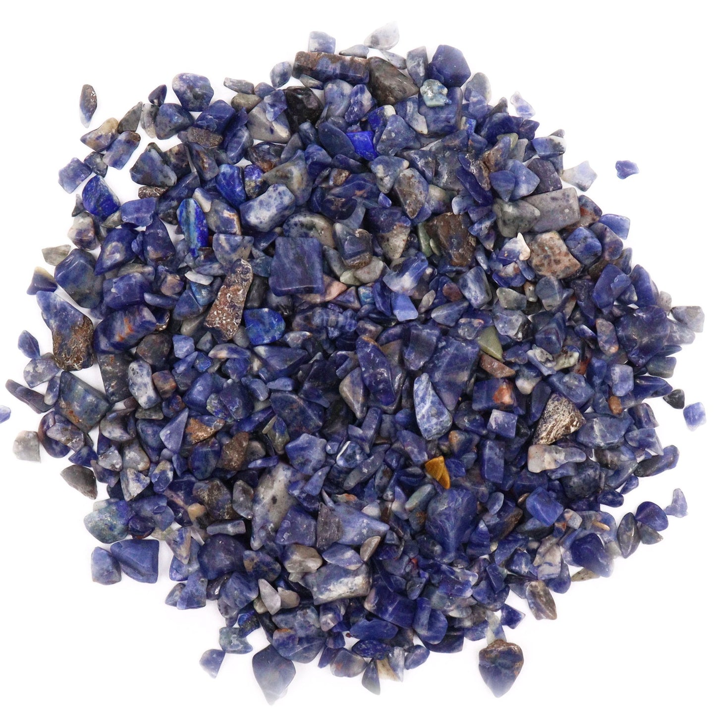 A large collection of small, polished deep blue sodalite gemstone chips with natural white veining.