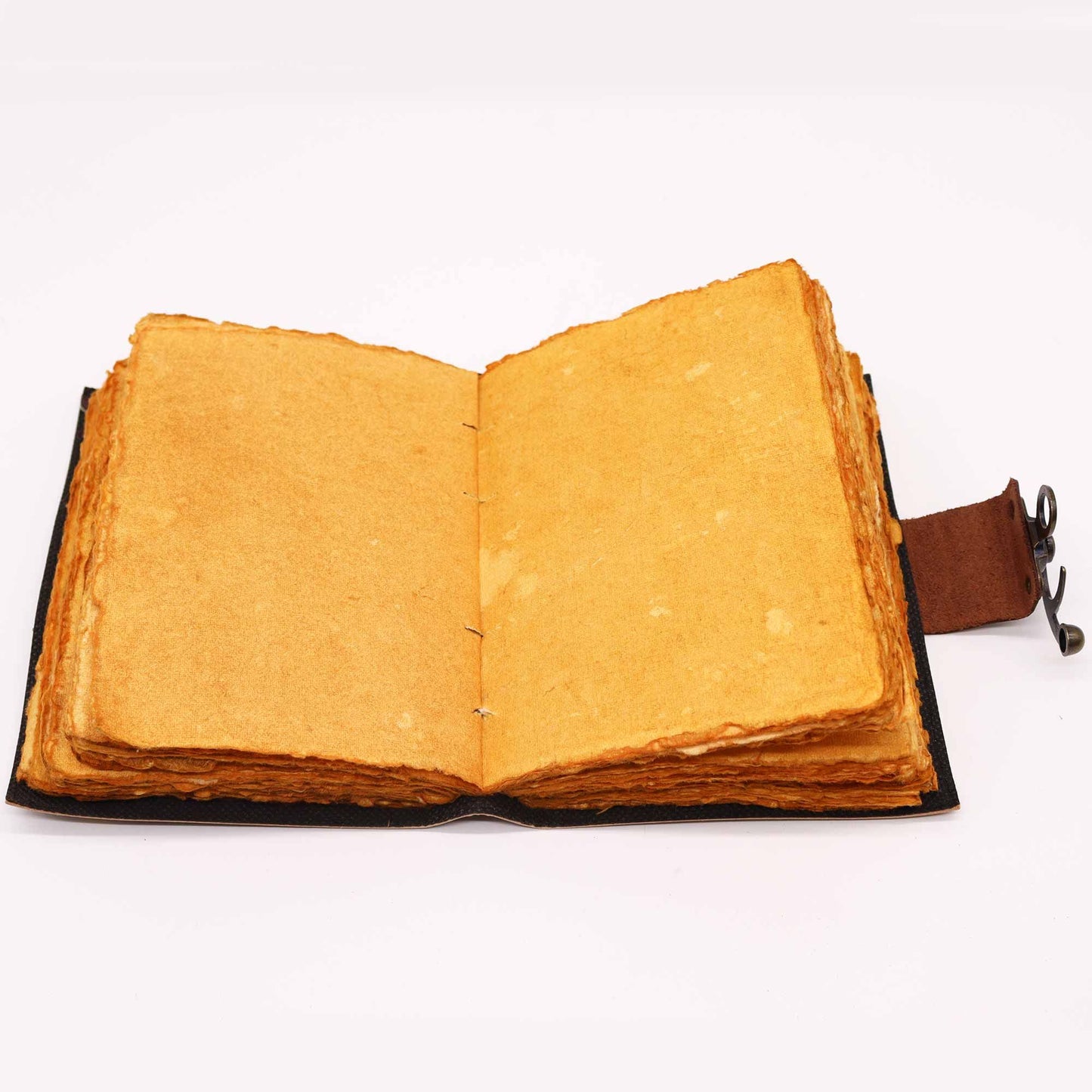Vintage-style brown leather notebook featuring an embossed lotus mandala design and a traditional metal clasp closure.
