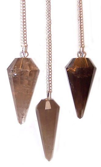 A pointed smoky quartz crystal pendulum attached to a delicate silver-toned chain with a small bead at the end.