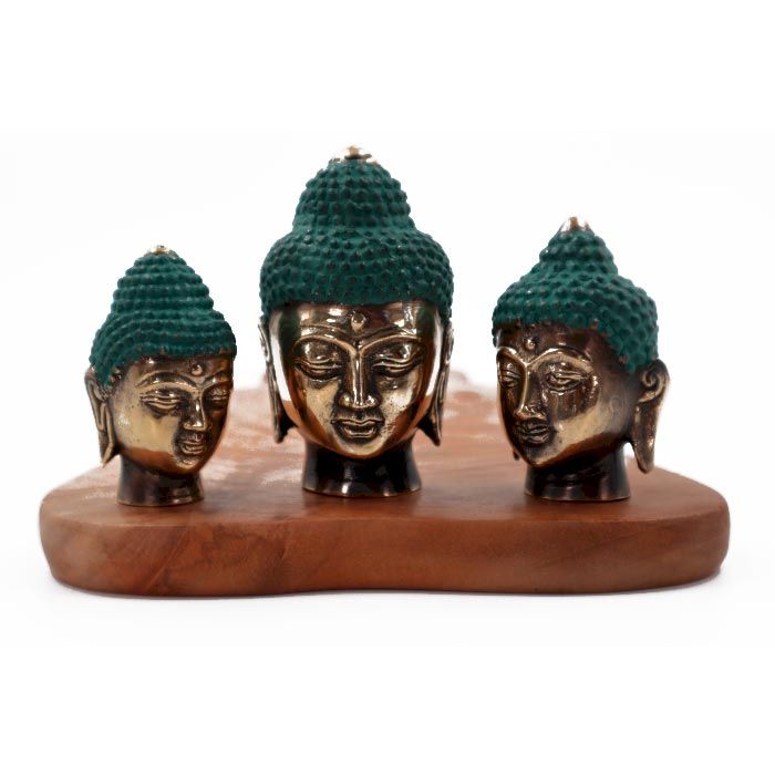 Set of three polished brass Buddha head statues in small, medium, and large sizes on a plain background.