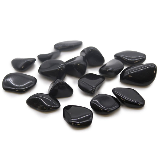 A smooth, polished jet-black obsidian tumble stone with a reflective, glassy surface.