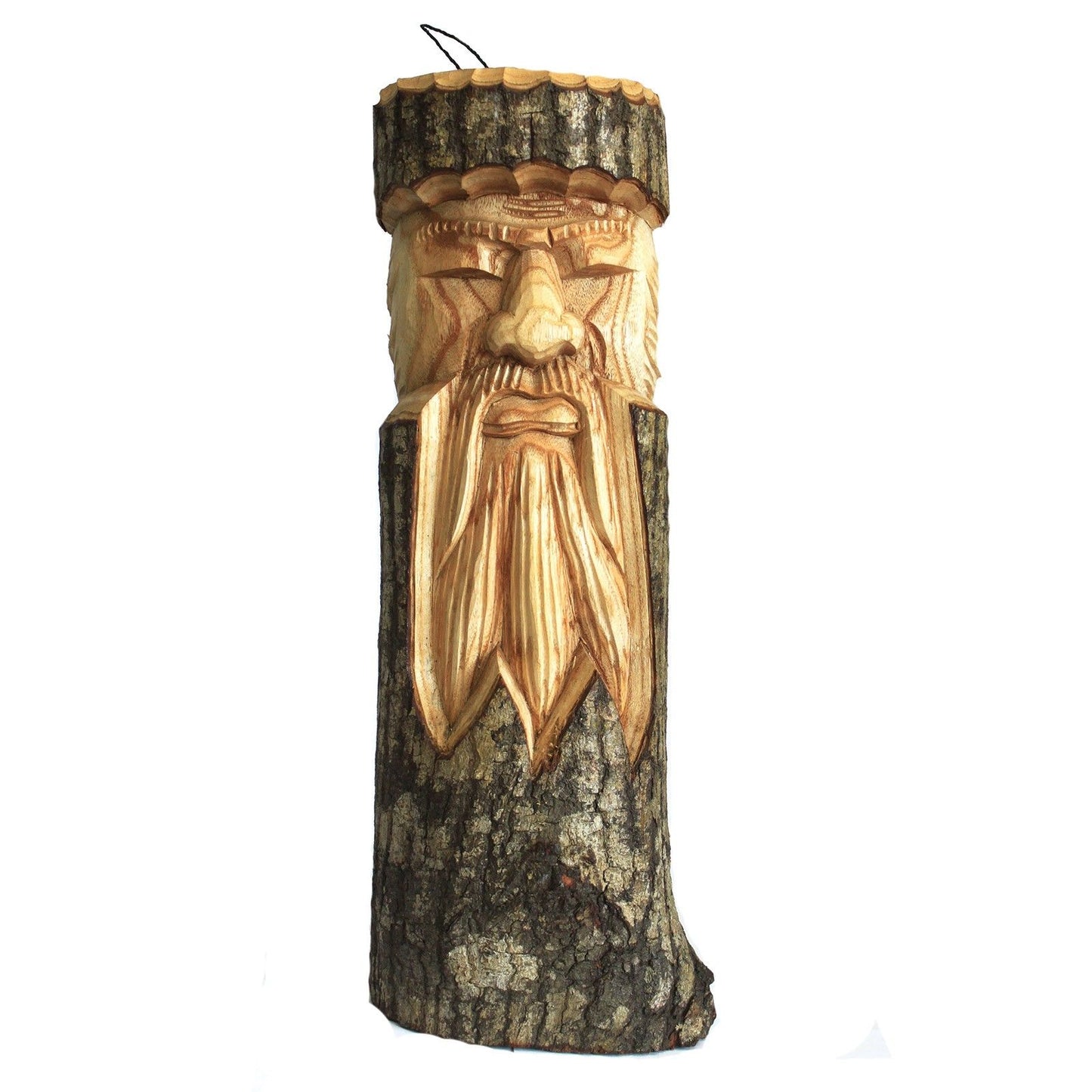 Intricate wood carving of an old man's face on a natural tree trunk stump with rustic textures.