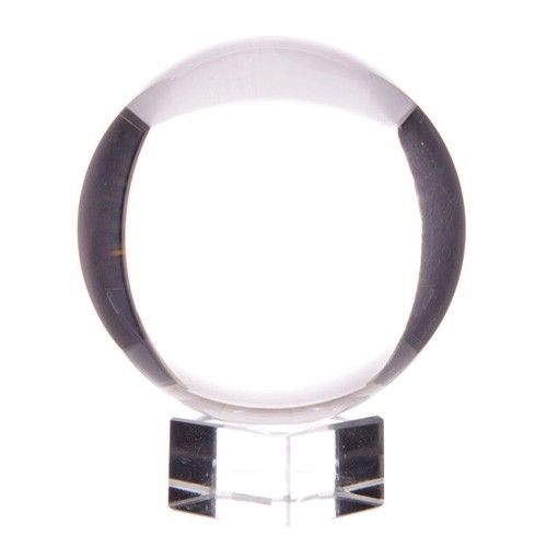 Large 130mm clear glass crystal ball resting on a simple wooden stand against a neutral background.