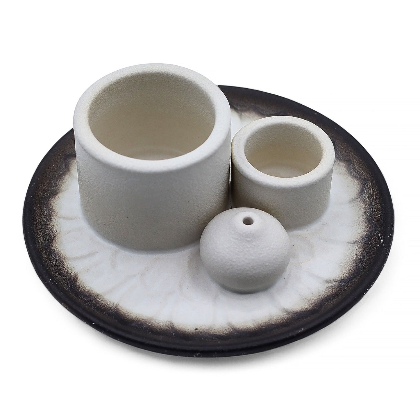 White and grey ceramic palo santo and smudge stick holder featuring an intricate mandala design.