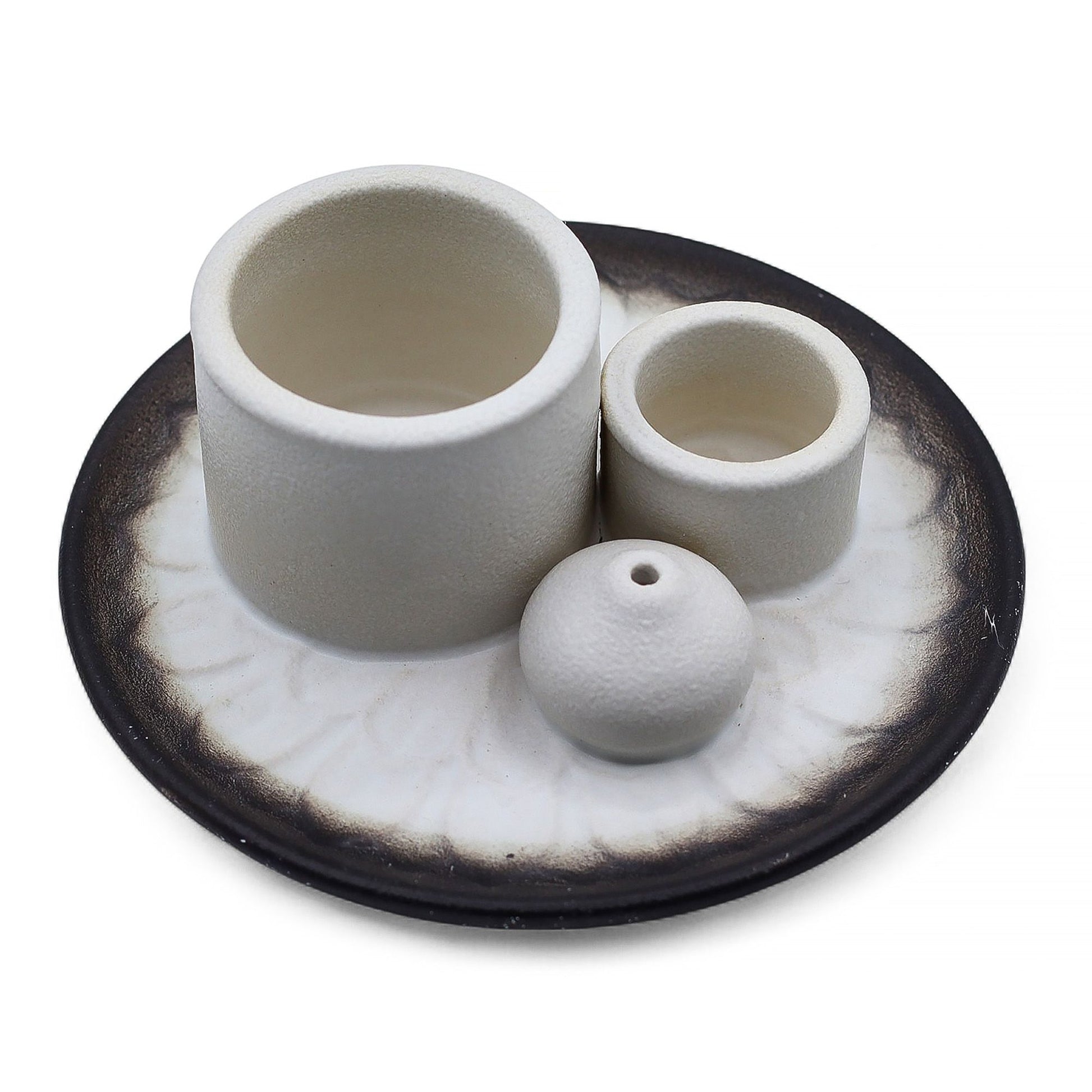 White and grey ceramic palo santo and smudge stick holder featuring an intricate mandala design.