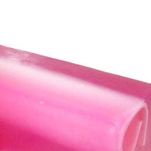 Large artisanal soap block with a vibrant pink and dark speckled texture, reflecting a raspberry and black pepper blend.