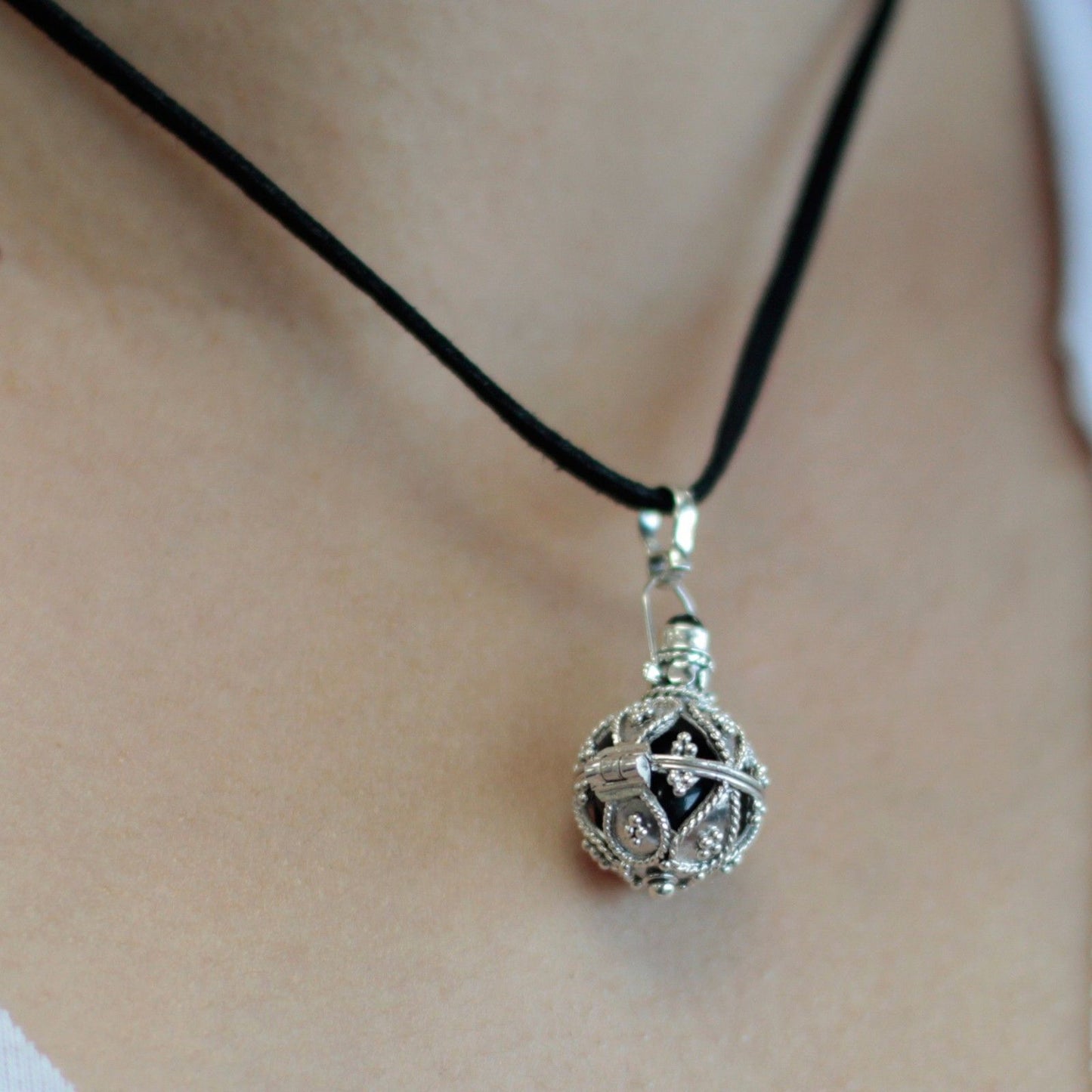Intricate 16mm 925 sterling silver angel bell pendant with a traditional Balinese design.