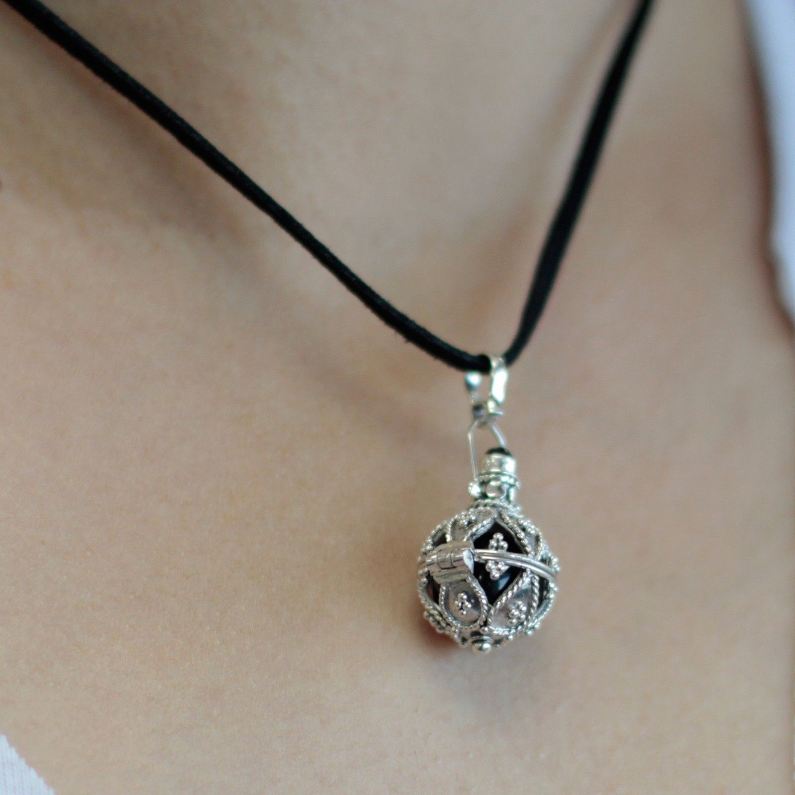Intricate 16mm 925 sterling silver angel bell pendant with a traditional Balinese design.