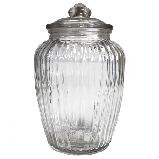 Large clear glass storage jar featuring a decorative ribbed pumpkin shape and matching glass lid.