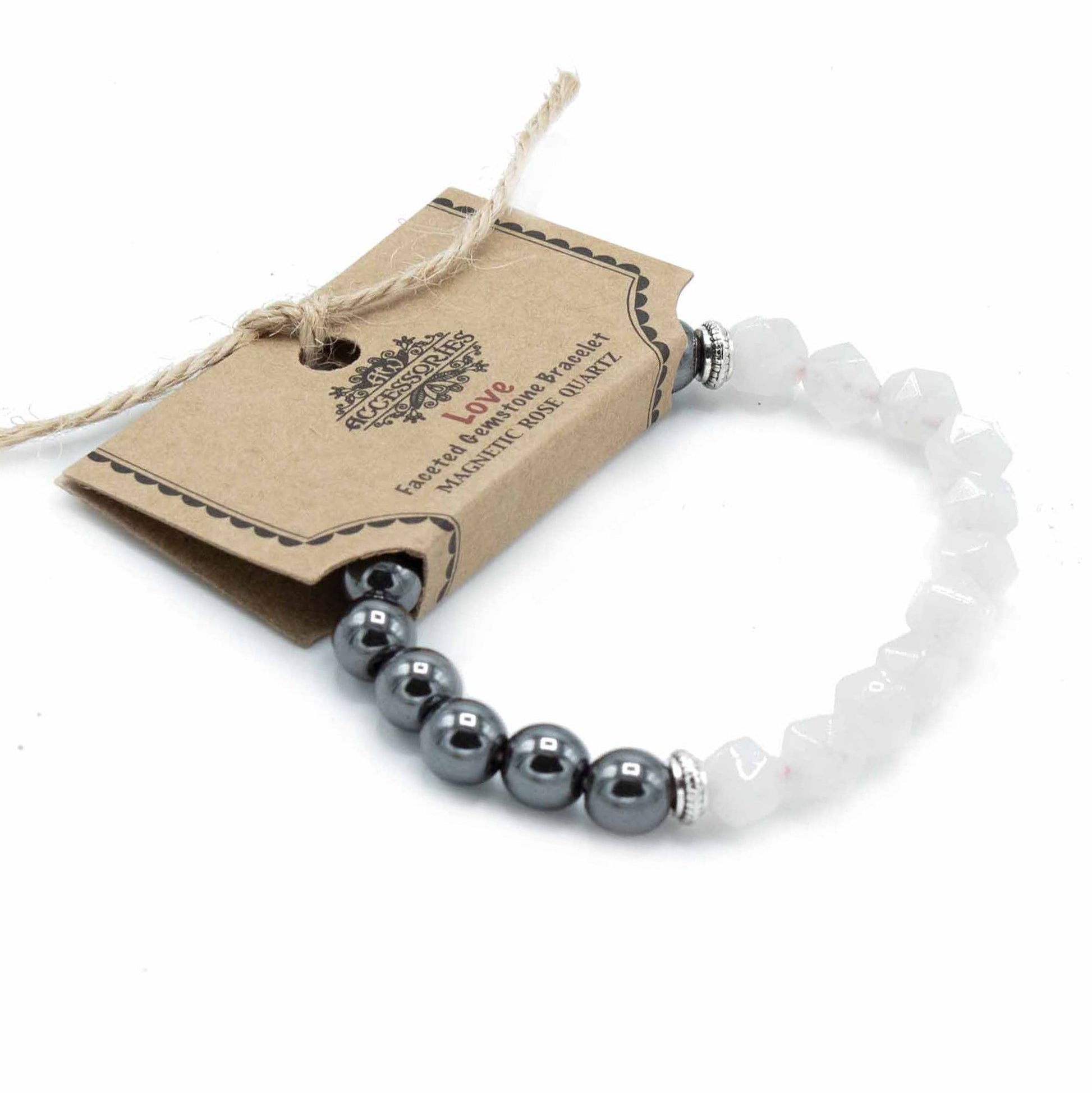 Sparkling faceted pink rose quartz beads on a magnetic gemstone bracelet reflecting light.