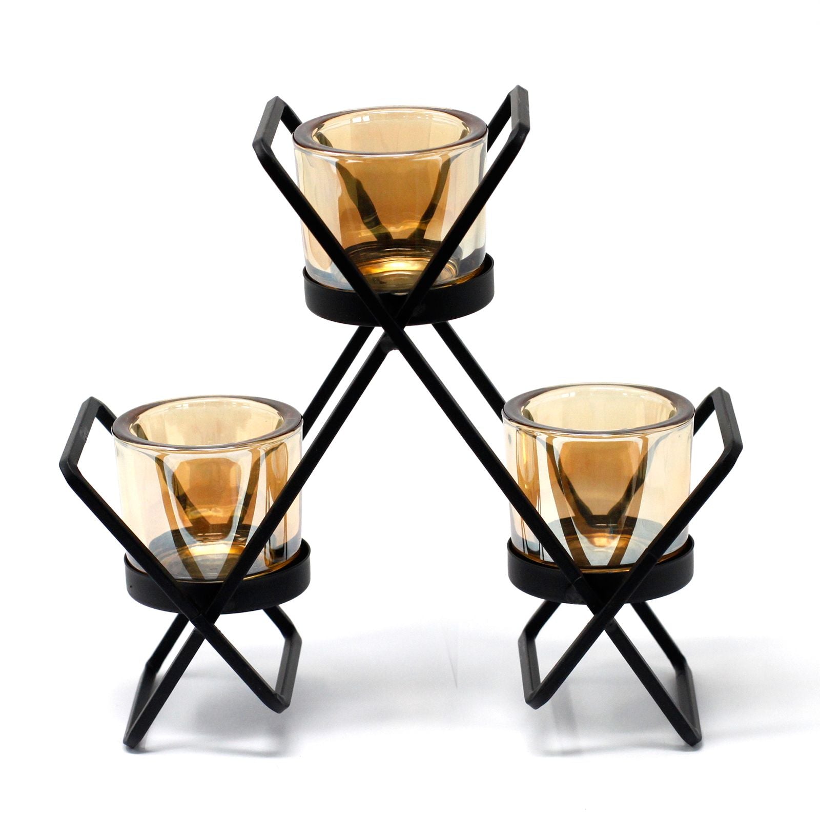Geometric triangle-shaped black iron candle holder with three glass votive cups on a flat surface.