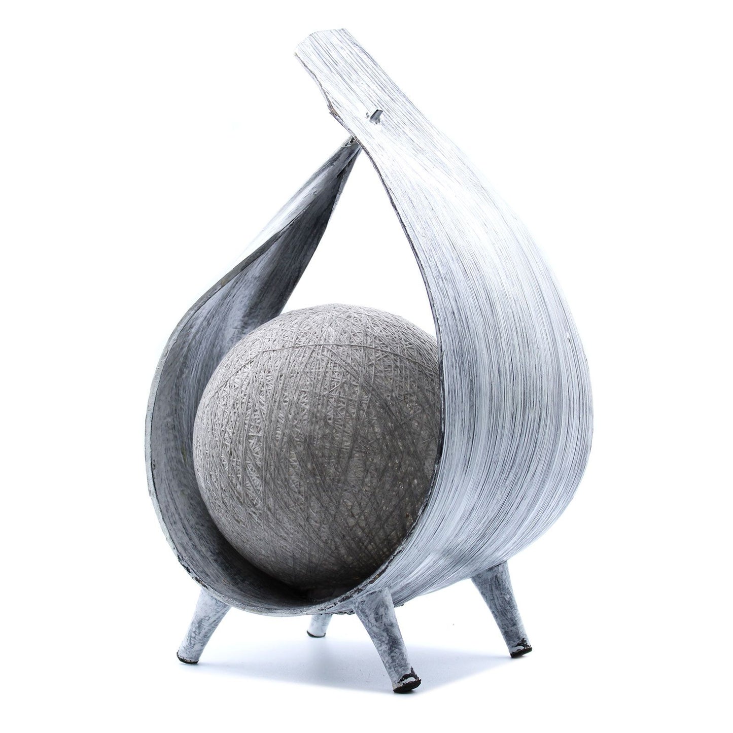 Handcrafted coconut leaf lamp with a greywash finish and elegant wrapover design, emitting a warm ambient glow.