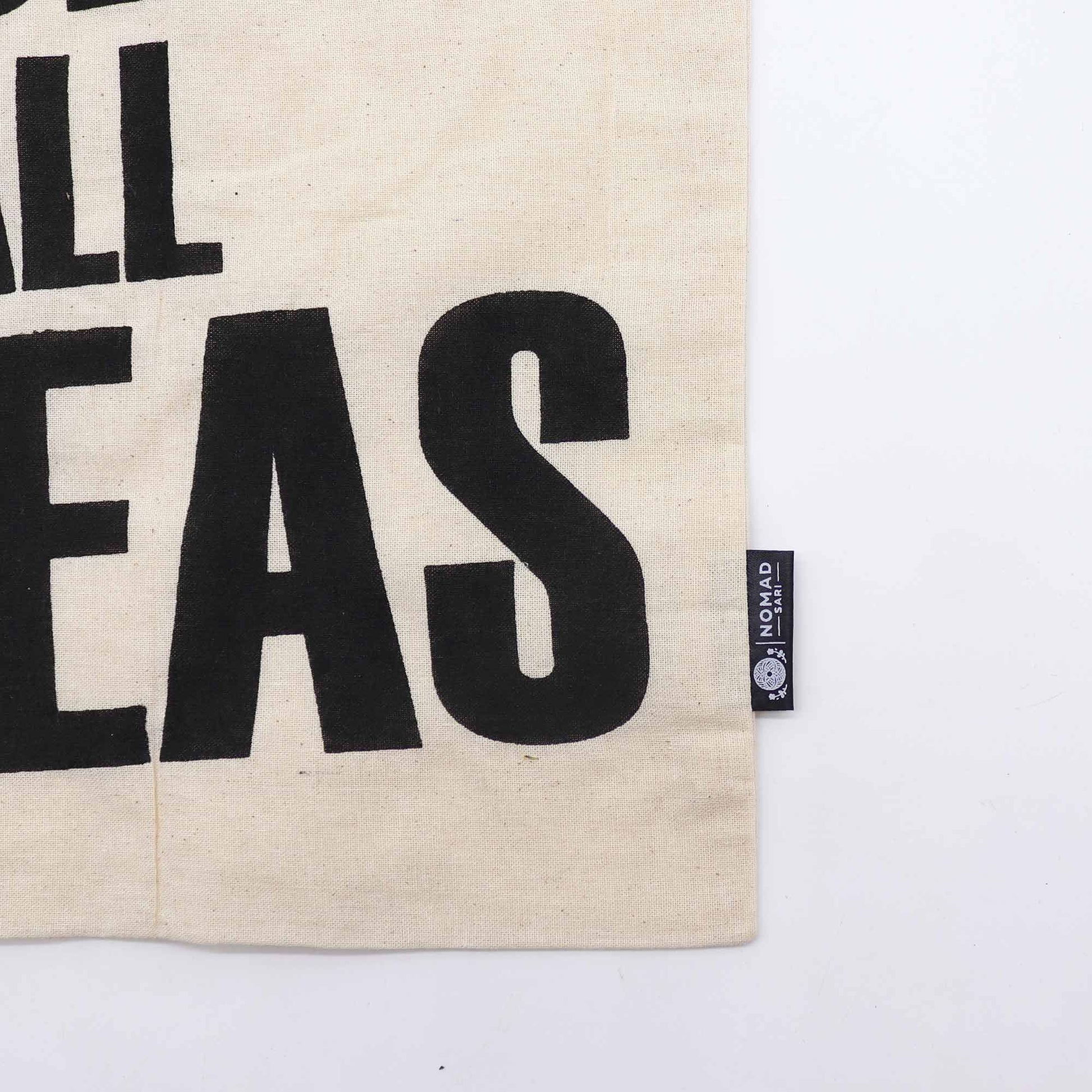 Eco-friendly natural cotton tote bag featuring a bold black Access All Area typographic design on the front.