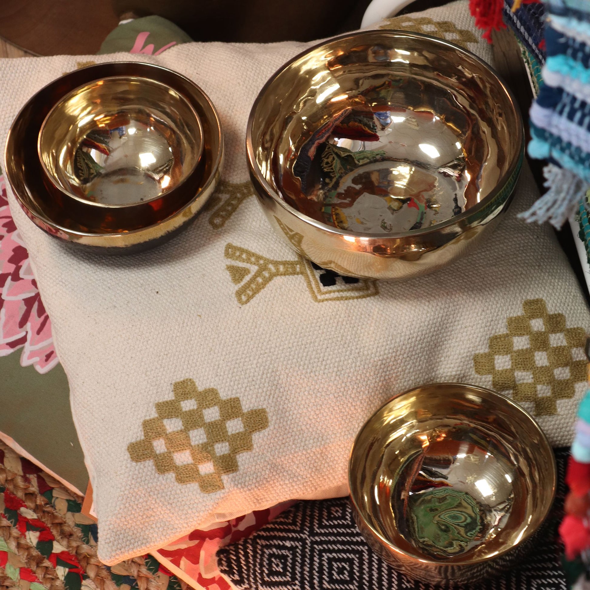Large polished gold-tone bell-metal singing bowl with a handcrafted finish and smooth rounded edges.