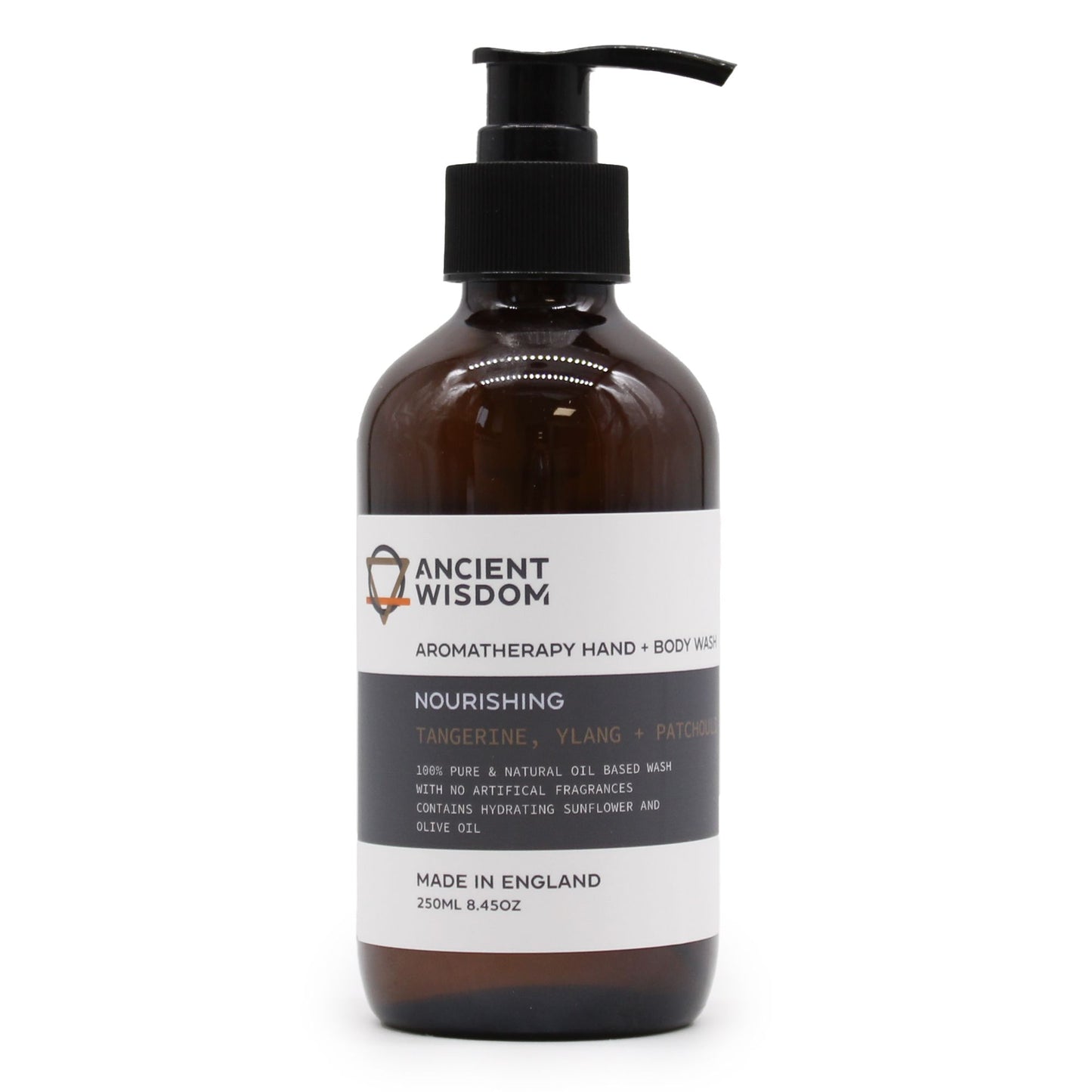 Clear bottle of amber-coloured aromatherapy hand and body wash with a black pump dispenser.