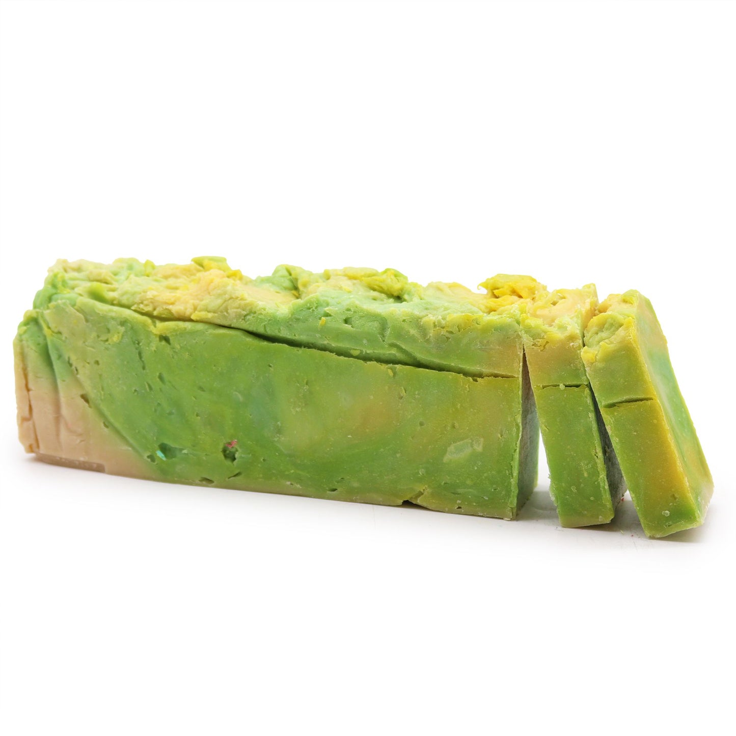 Handcrafted olive oil soap loaf with a rustic texture and natural pale green hue on a wooden surface.