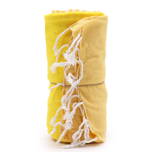 Large sunny yellow handcrafted cotton towel with fringe detailing, displayed as a lightweight summer pareo throw.