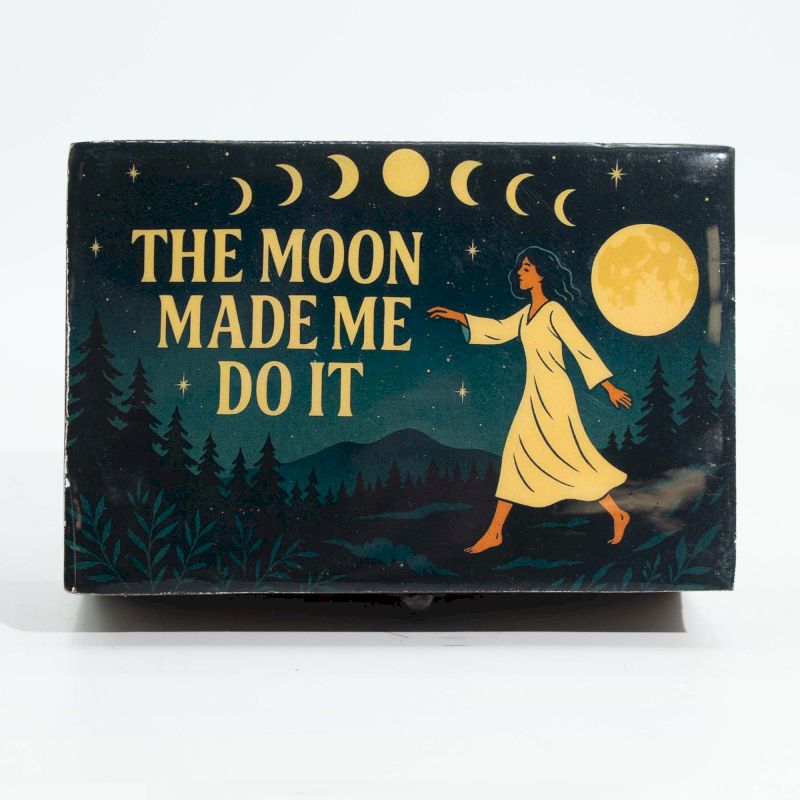 Circular mango wood box with an enamelled lid featuring moon phases, a forest, and a mystical figure under a full moon.