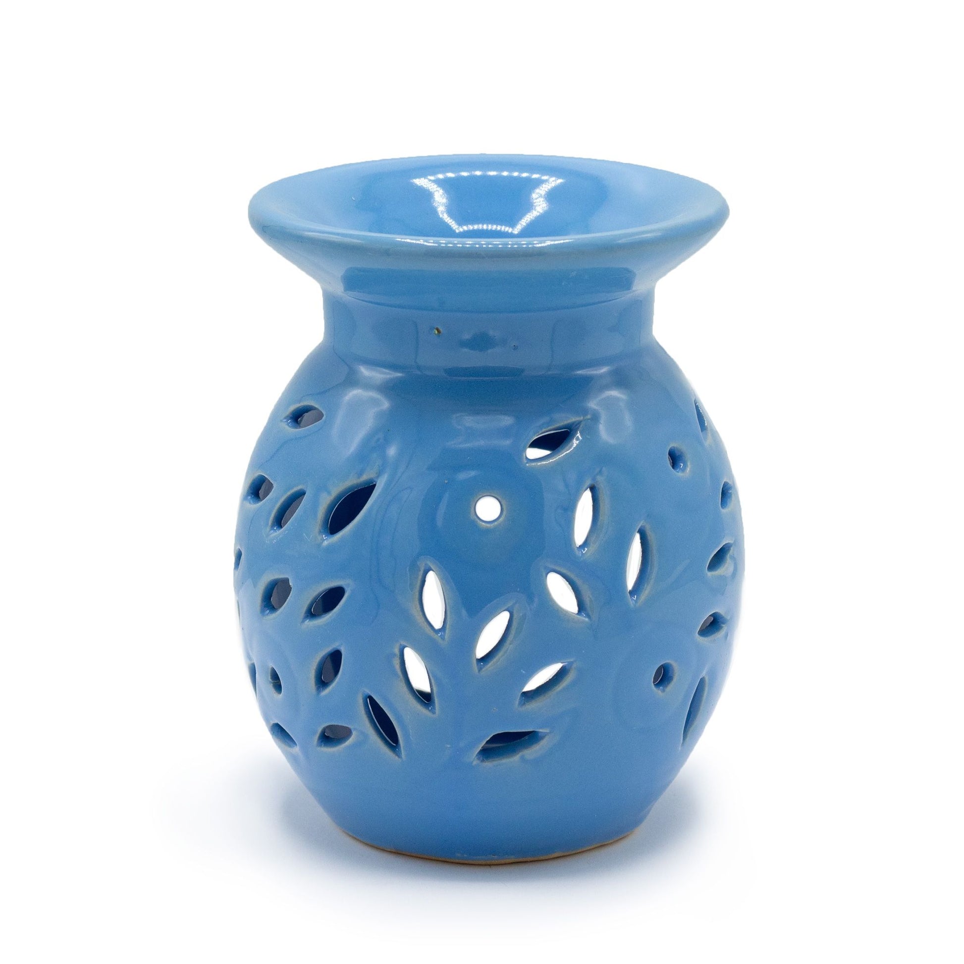 Blue ceramic oil burner with a delicate white floral pattern and cut-out details for candlelight.