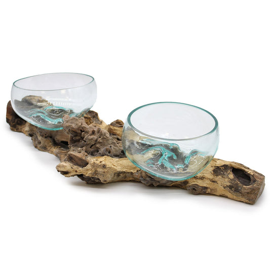 Large molten glass bowl artistically slumped over a natural double branch wood stand.