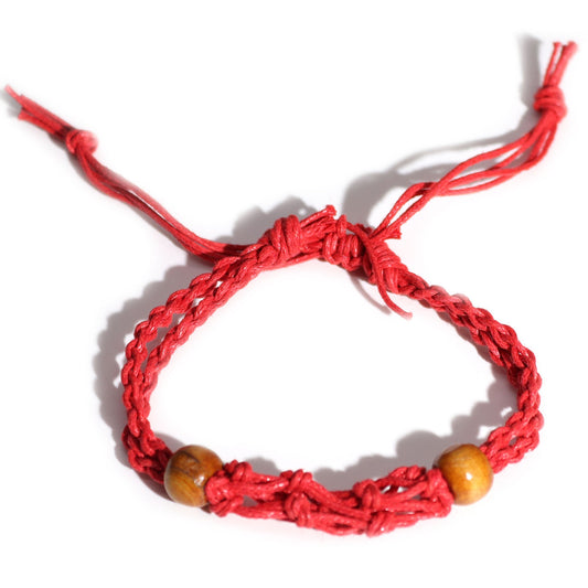 Adjustable vibrant red cord for creating gemstone bracelets, showing its durable texture and energy-infused hue.