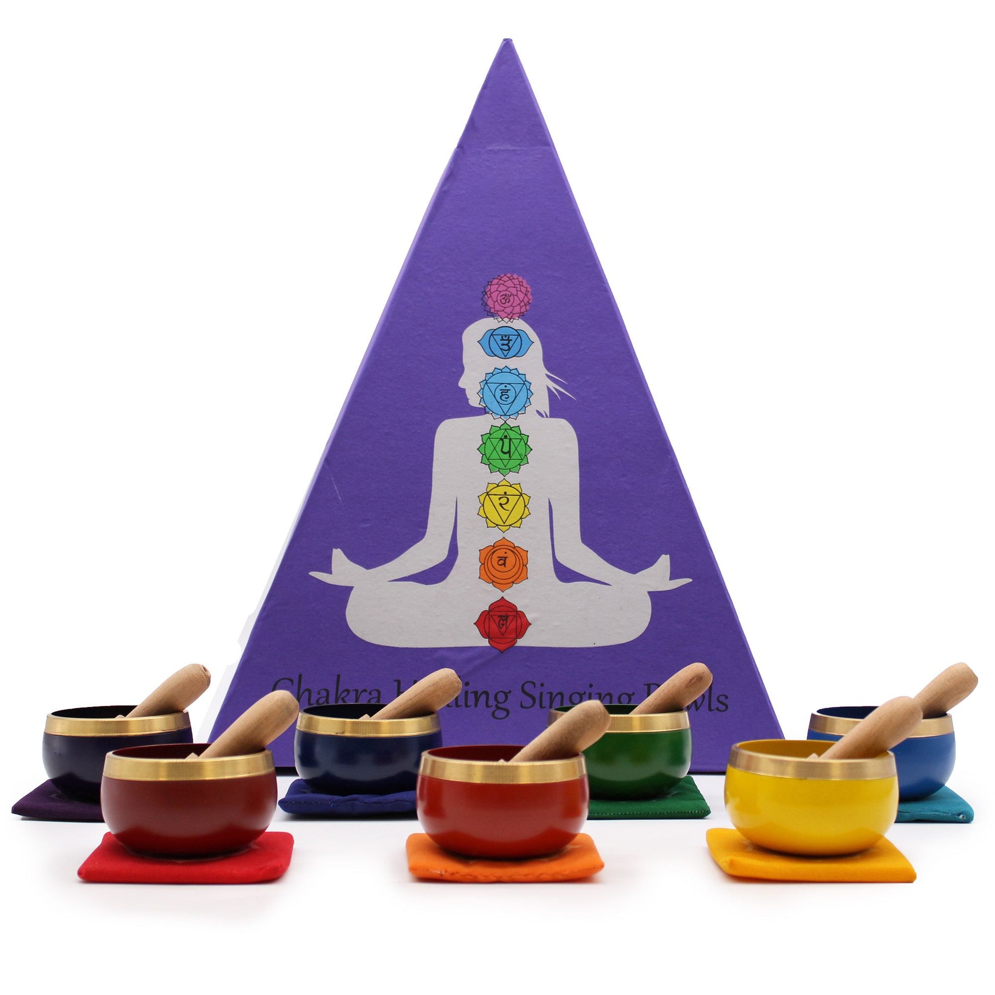 Seven colourful chakra singing bowls arranged in a pyramid shape with wooden strikers on a neutral background.