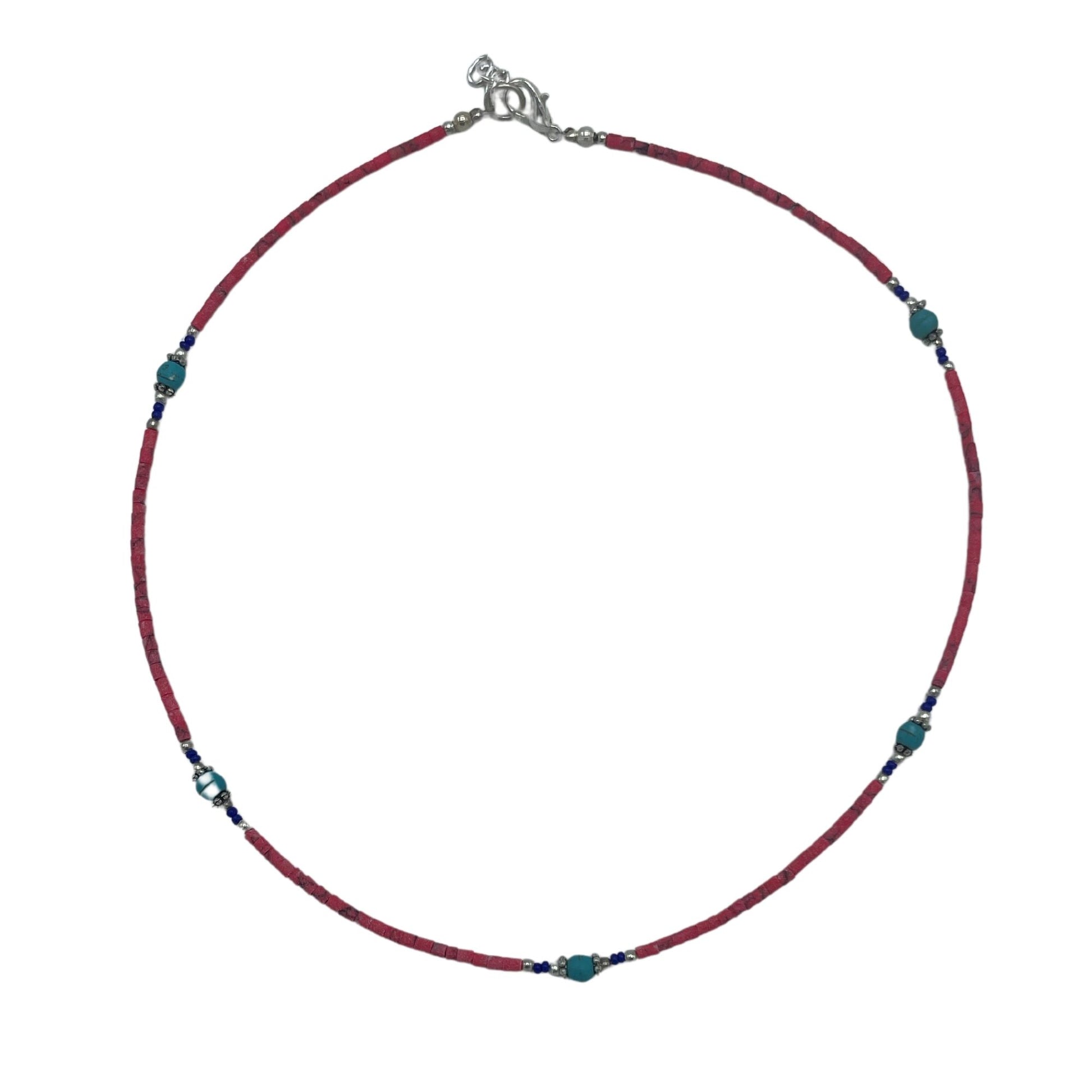 Handcrafted Nepalese necklace featuring a striking contrast of polished pink coral and blue turquoise beads.