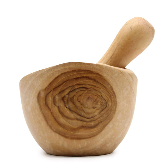 Handcrafted medium-sized teak wood pestle and mortar with a natural wood grain finish and ergonomic design.