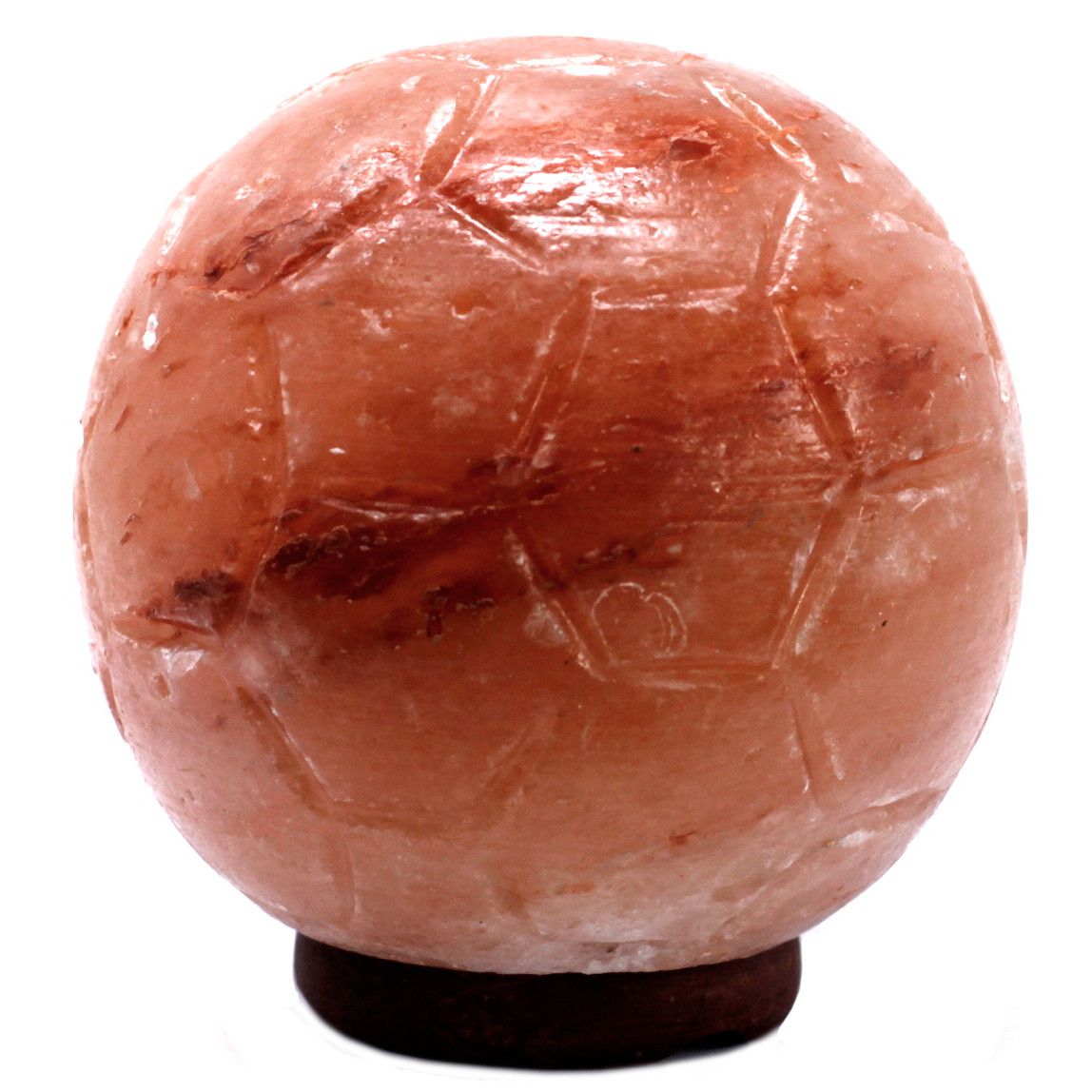 Hand-carved Himalayan salt lamp shaped like a football on a wooden base with a warm orange glow.
