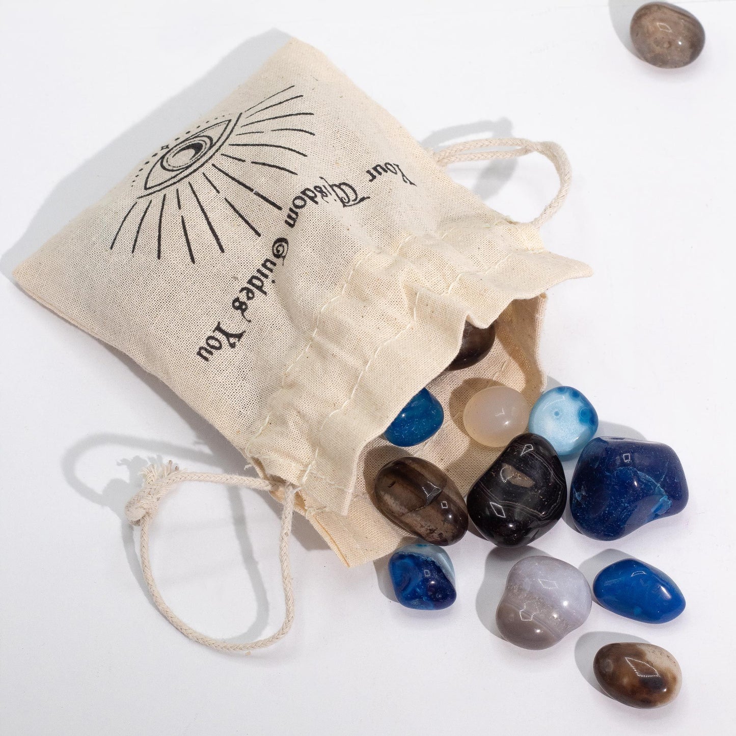 A 1kg pile of smooth, polished tumbled agate stones in various natural and dyed shades of blue, green, and earthy brown.