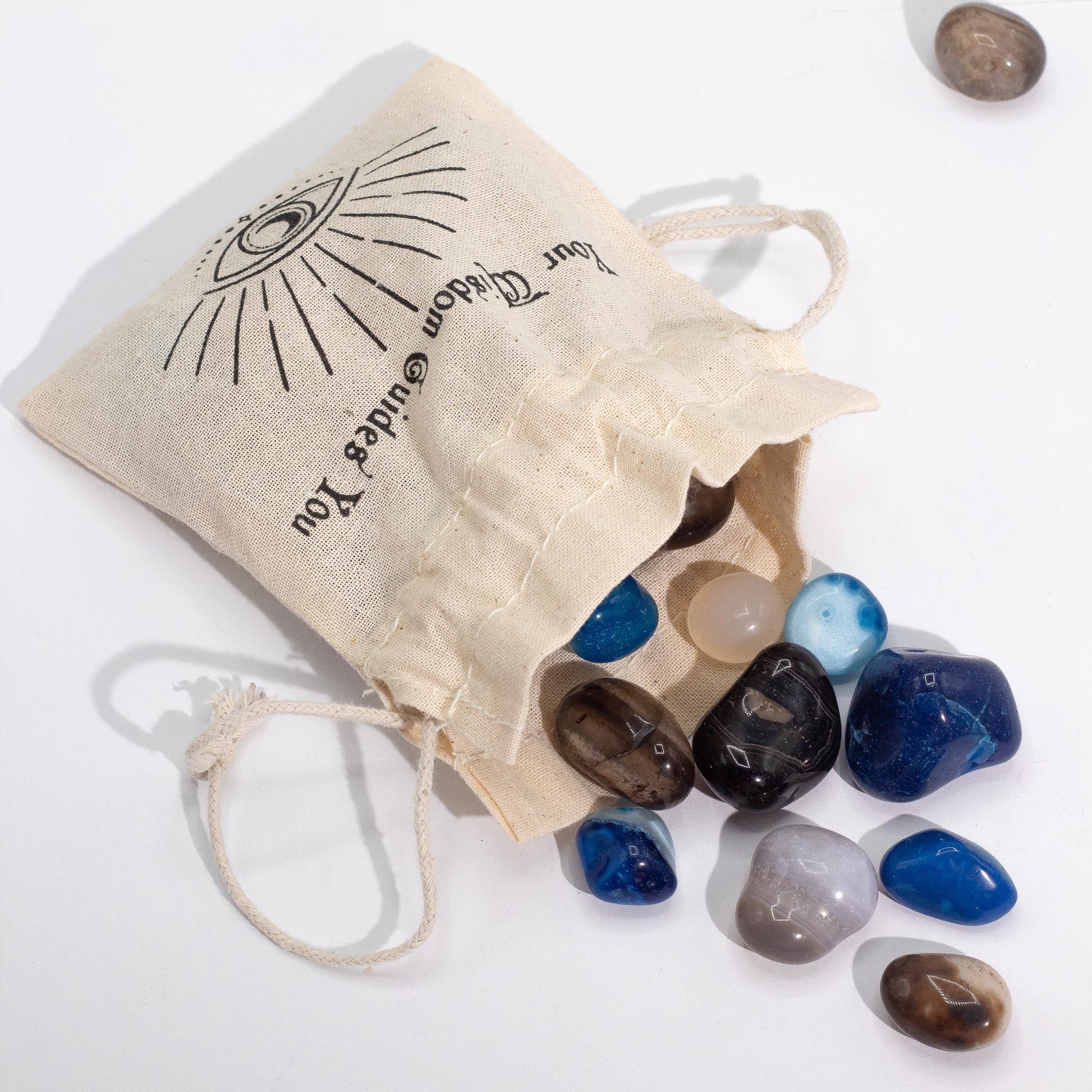 A 1kg pile of smooth, polished tumbled agate stones in various natural and dyed shades of blue, green, and earthy brown.