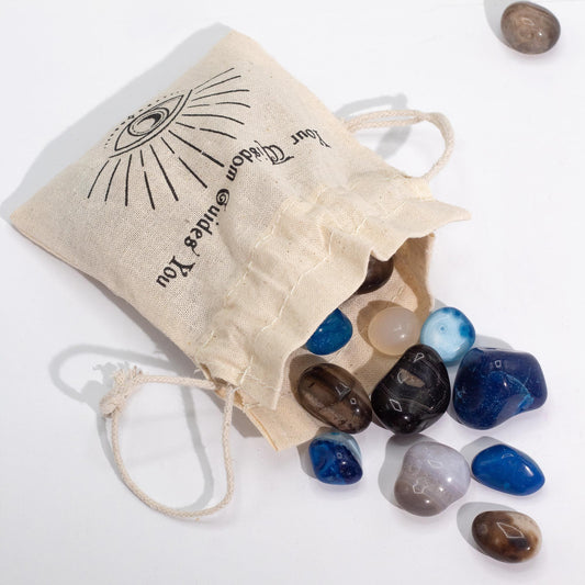 A 1kg pile of smooth, polished tumbled agate stones in various natural and dyed shades of blue, green, and earthy brown.