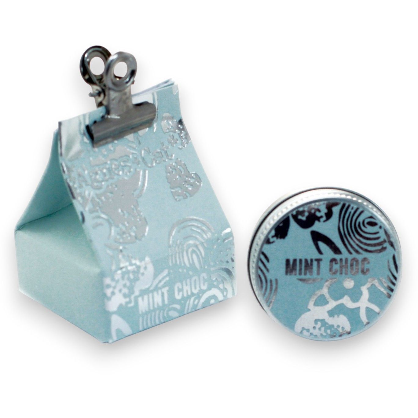 A small round tin of smooth, natural lip balm with a creamy texture, perfect for hydrating dry lips.