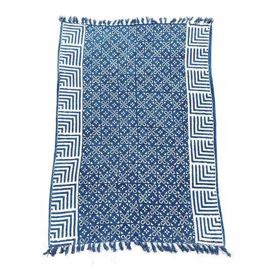 Handmade indigo cotton throw featuring an intricate geometric Kasba Tiles pattern in deep blue and white.