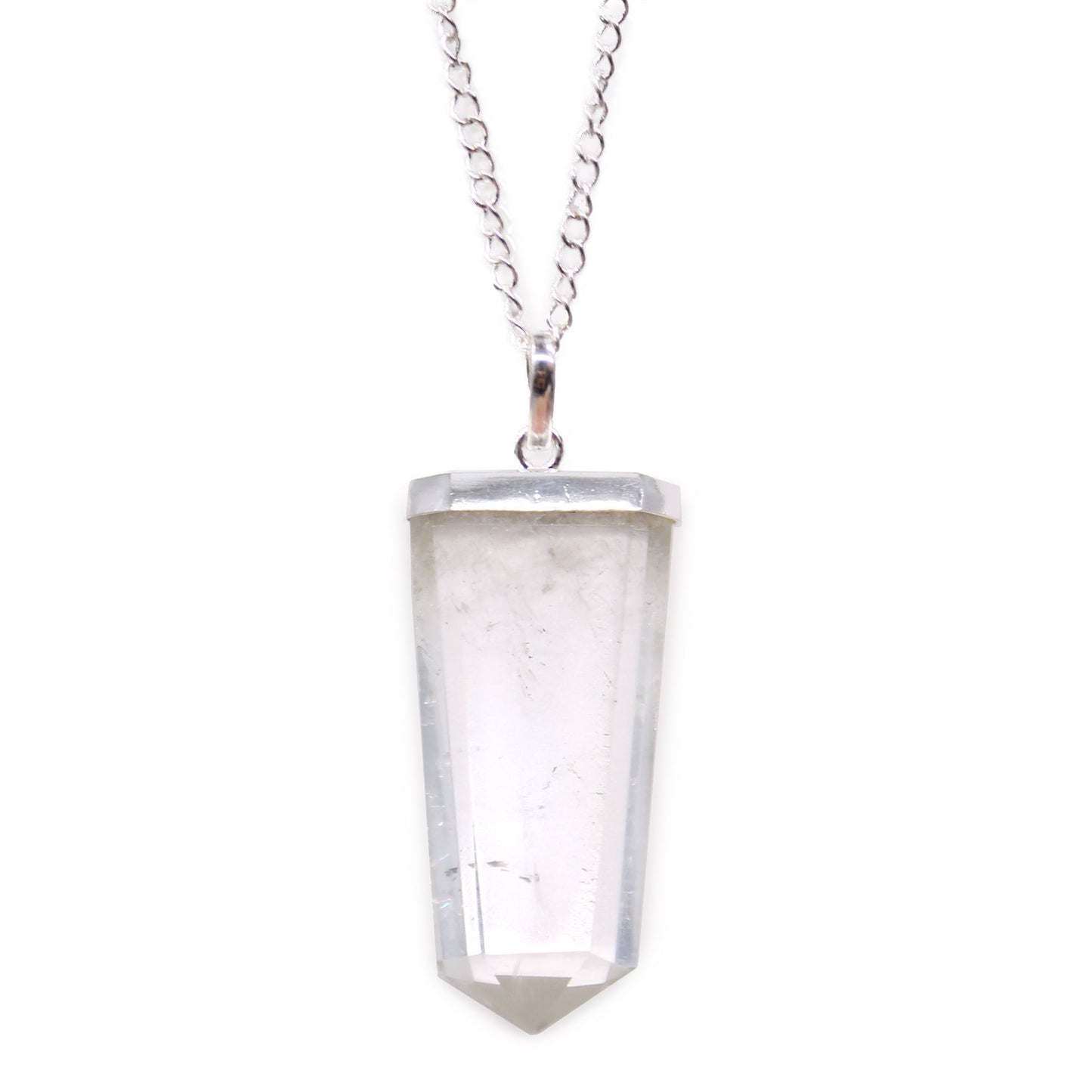 Clear rock quartz gemstone carved into a flat pencil-shaped pendant with a silver-tone bail.