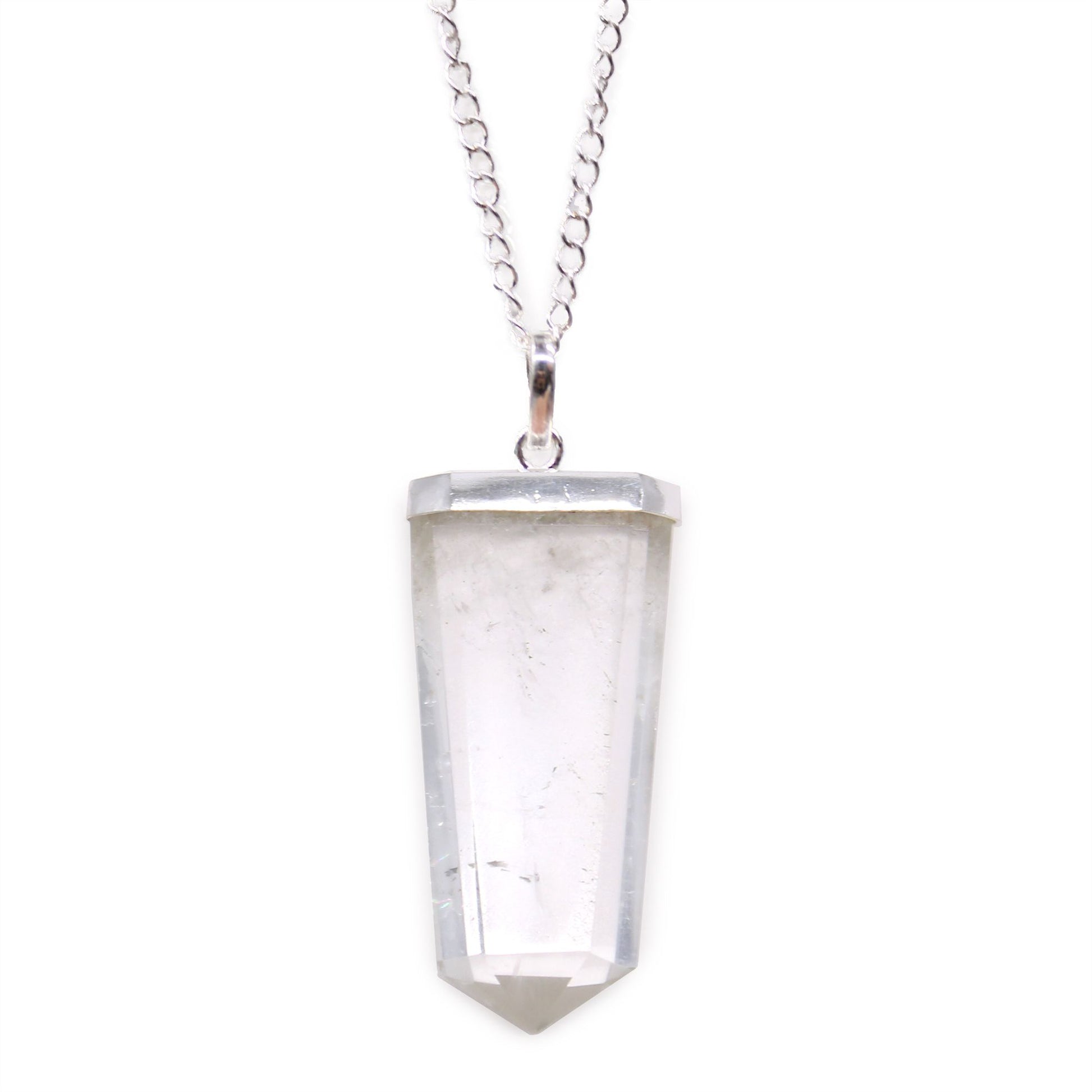 Clear rock quartz gemstone carved into a flat pencil-shaped pendant with a silver-tone bail.