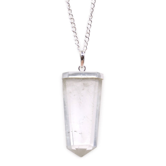 Clear rock quartz gemstone carved into a flat pencil-shaped pendant with a silver-tone bail.