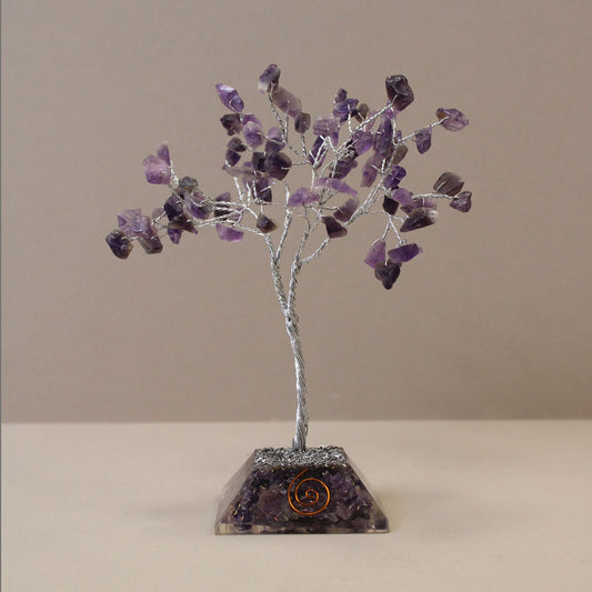 Beautiful Amethyst gemstone tree with purple crystal leaves on a wire frame standing on a circular orgonite base.