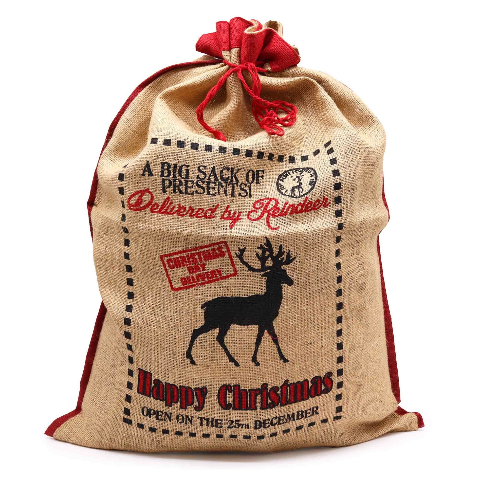 Large rustic jute Christmas gift sack featuring a festive Delivered By Reindeer print and sturdy drawstring closure.