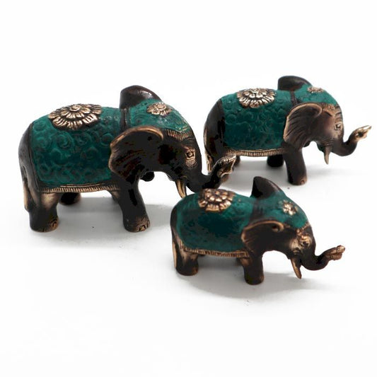 Three polished brass elephant statues in varying sizes, featuring raised trunks for good luck and prosperity.
