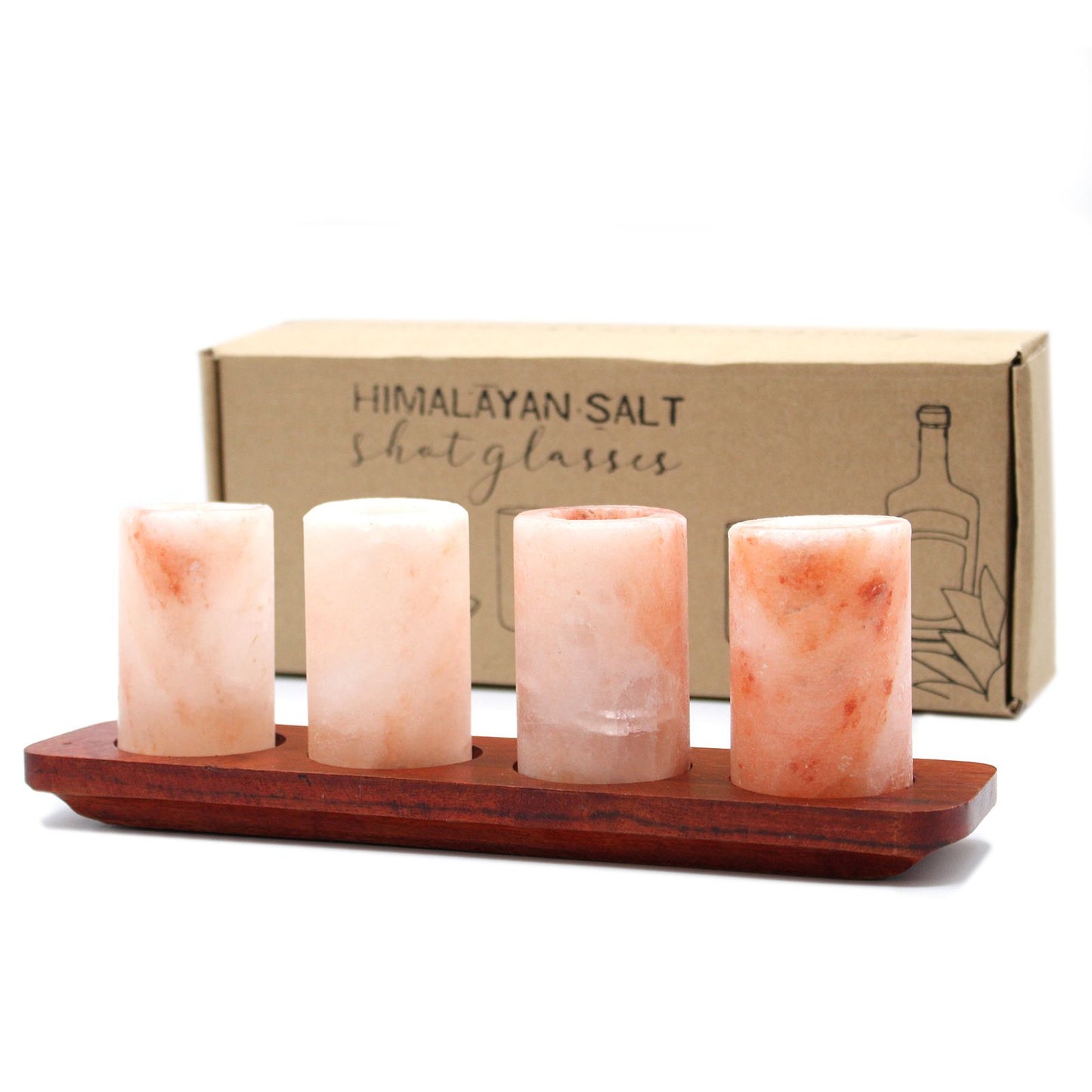 Four pink Himalayan salt shot glasses arranged on a rustic wooden serving stand with circular carved slots.