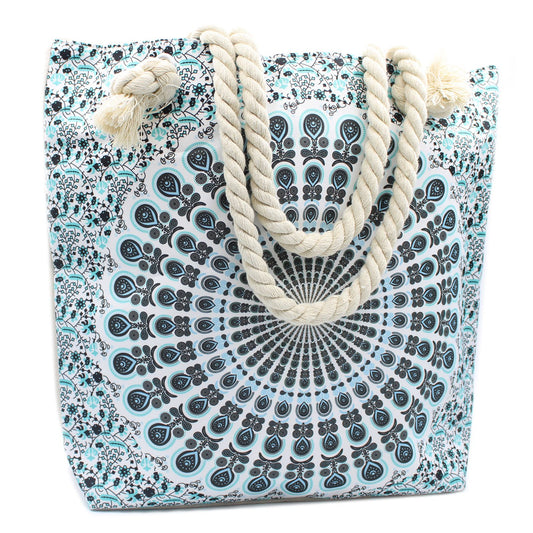 Large sky blue tote bag with an intricate white mandala pattern and thick cream rope handles.